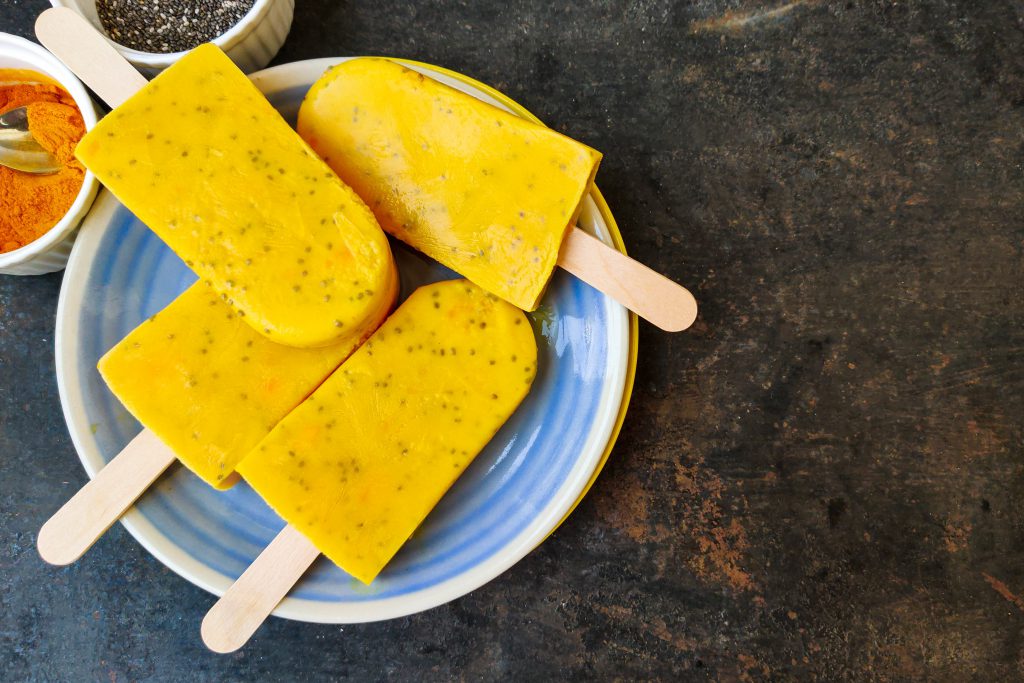 Immune Booster.  Four Nutty Turmeric Popsicle kept on plat