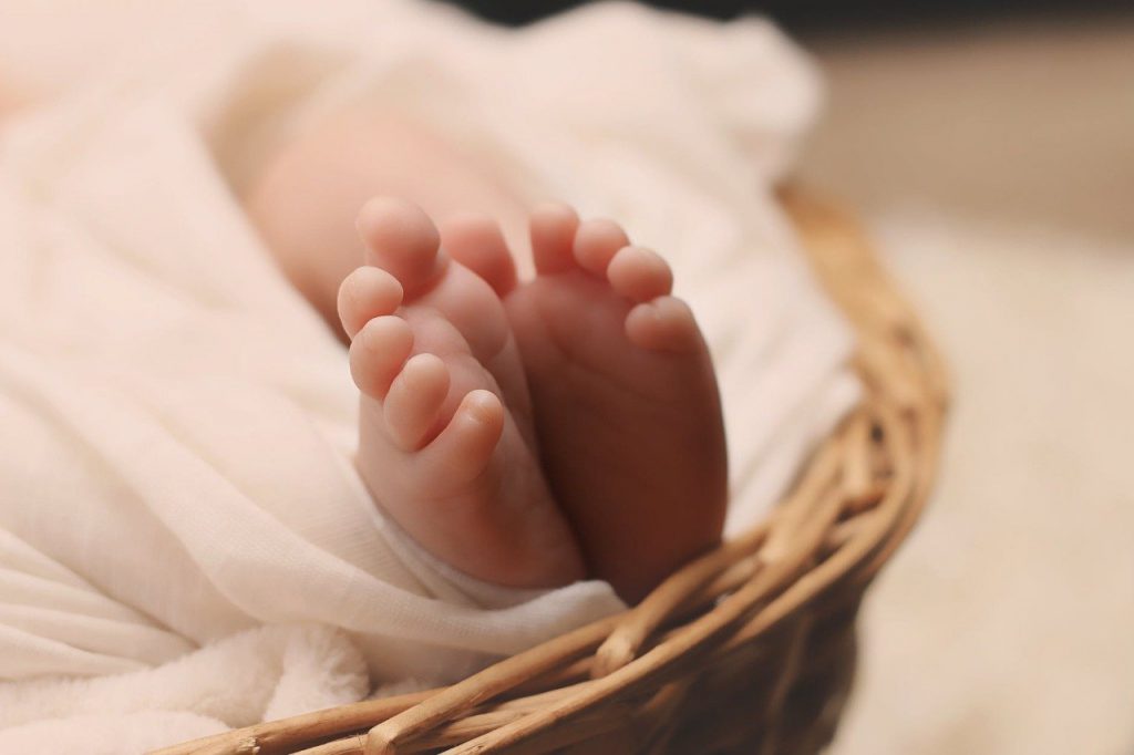 Indian Baby Boy Names And Baby Girl Names. A new born's baby feet.