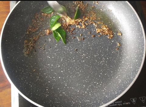 In a pan saute cumin seeds, crushed black pepper and curry leaves 