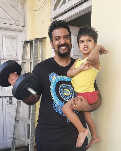 Peter working out with his son