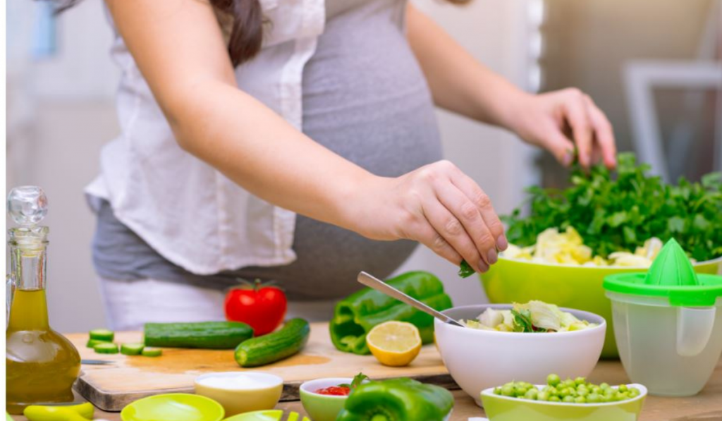 Pregnant woman preparing food