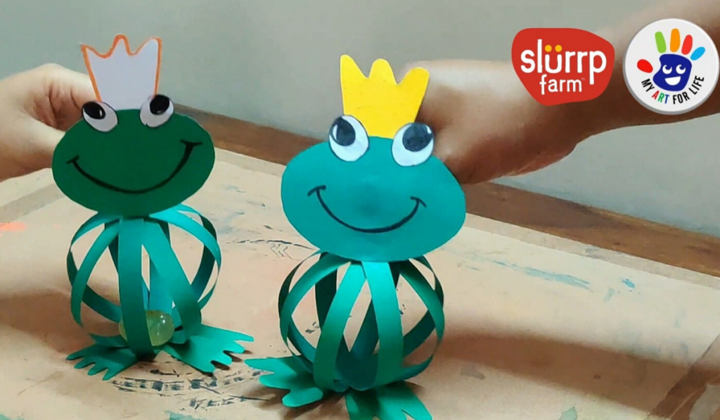 Bouncy Frog - Easy Paper Crafts for Kids during Monsoon. Two paper frogs smiling.