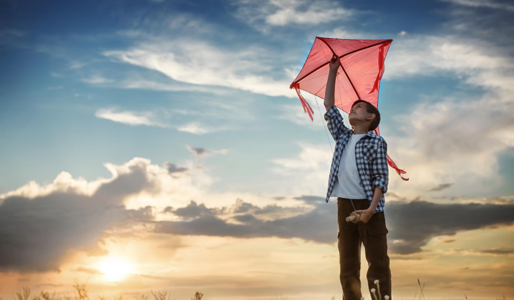 Independence Day Kids Activities. A boy holding a kite