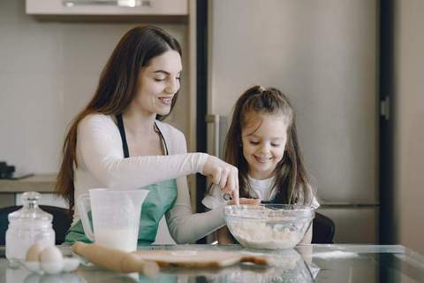 Mom and daughter cooking