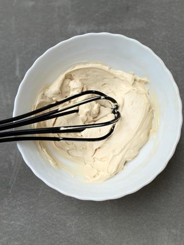 Bowl with ingredients of Slurrp Farm Jaggery Powder and vanilla essence